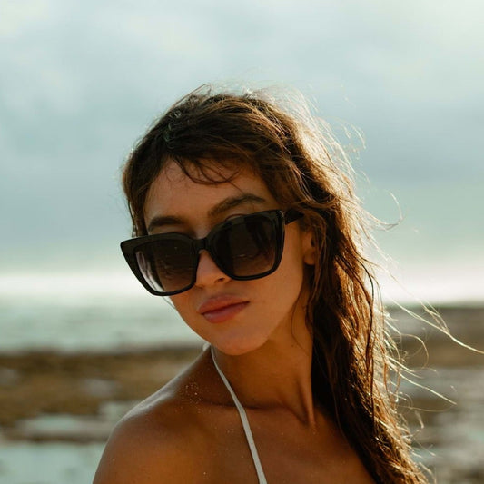 Woman wearing black cat eye sunglasses a